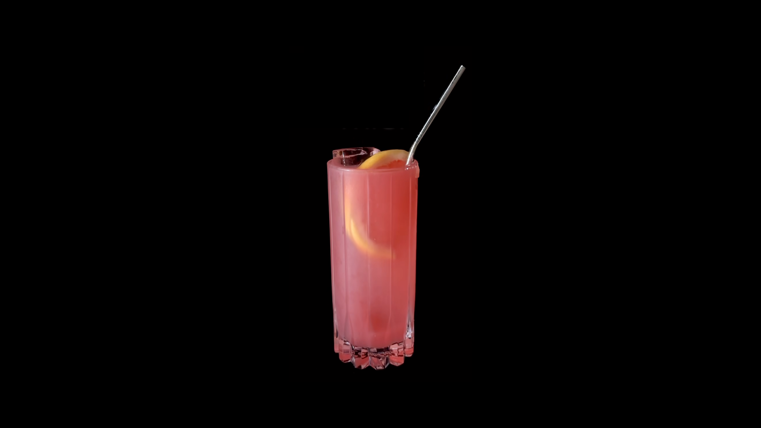 Pink Bicycle Thief cocktail in a tall highball glass with ice, lemon wheel, and metal straw against a black background