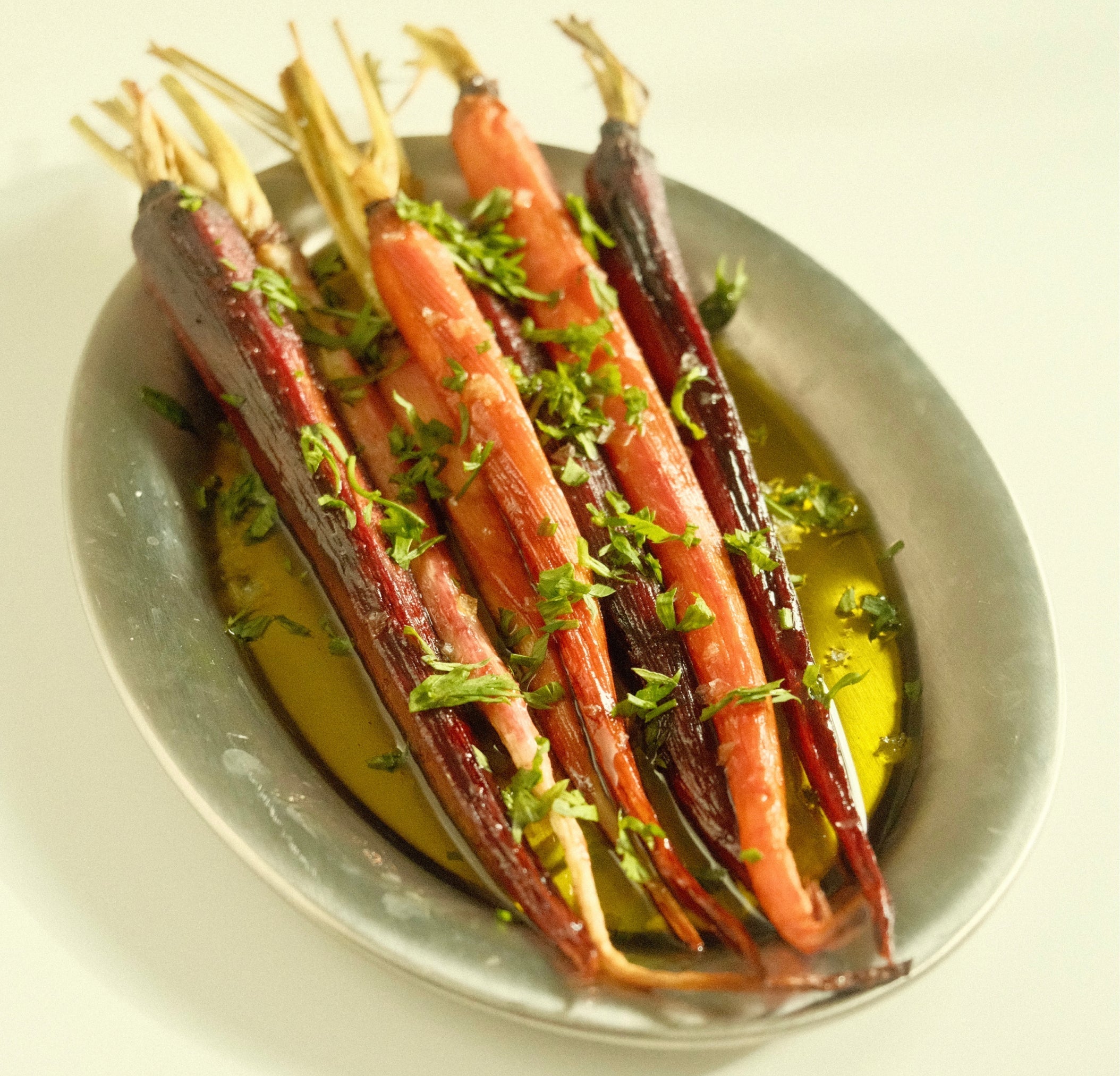 roasted carrots on silver plate