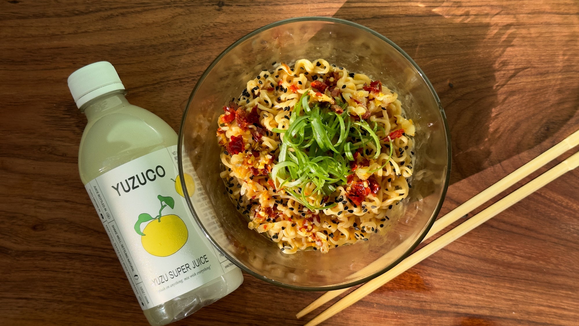 yuzuco yuzu super juice next to a bowl of upgraded ramen