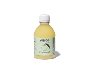 Front view of 8.7oz Sudachi juice bottle showcasing pale yellow juice and YUZUCO label on white background