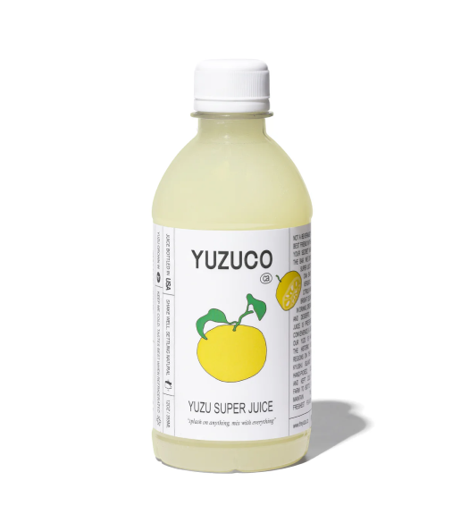 a bottle of yuzu super juice over white background