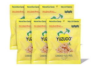 Front view of a 10-pack of Candied Yuzu Peel 30g bags showcasing bright yellow YUZUCO packaging on white background