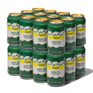 Front-right view of 12-pack of Green Tea Yuzu-Ade 12oz cans showcasing green can design with lemon graphic on white background