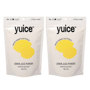 Front view of two 100g Lemon Juice Powder pouches showing Yuice logo and yellow lemon graphic on white background