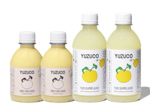 Front view of Yuzu Duo Double Duo pack showing four bottles, two 8.7 oz and two 13 oz Yuzu juice bottles on white background