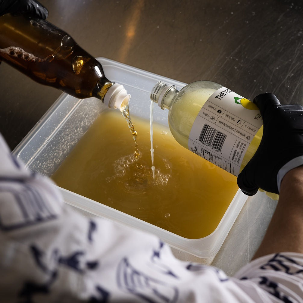 Chef Seigo mixing YUZUCO yuzu super juice and vinegar